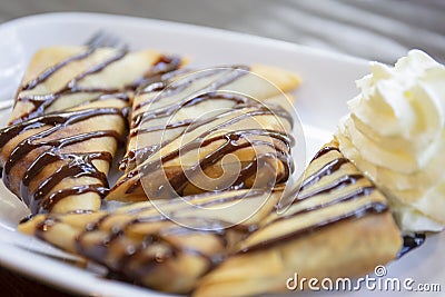 Banana samosas topped with chocolate Stock Photo