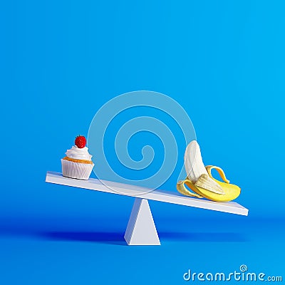 Banana sitting on seesaw with cupcake on opposite end on blue background Stock Photo