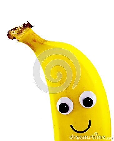 Banana with a happy smiley face. Stock Photo