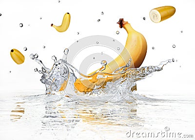 Banana splashing into clear water. Stock Photo