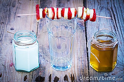 Banana and strawberry skewer on top of empty glass Stock Photo