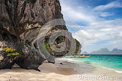 Banca boat on the beach of Entalula island in El nido region of Palawan in the Philippines. Editorial Stock Photo