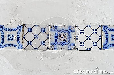 Band with ancient tiles on white wall in Petropolis Stock Photo