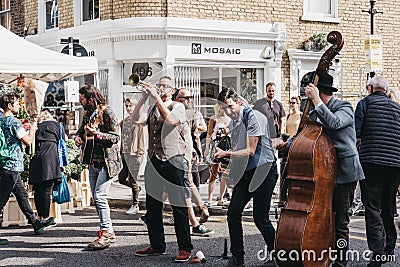 Band performing at the Columbia Road Flower Market, London Editorial Stock Photo