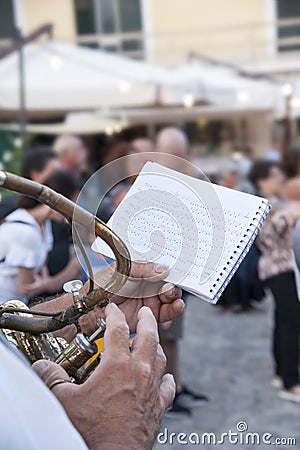Band player with his Queen Brass Sousaphone in the street. Stock Photo