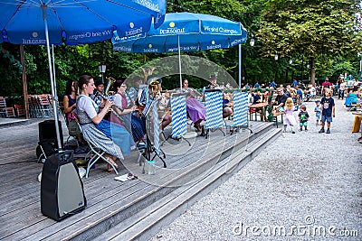 Band playing in a biergarten Editorial Stock Photo