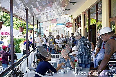 Band playing music at a patio of a restaurant Editorial Stock Photo