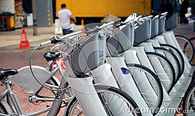 Bicycles for rental stand in a row on city street at Dataran Pahlawan, Melak Editorial Stock Photo