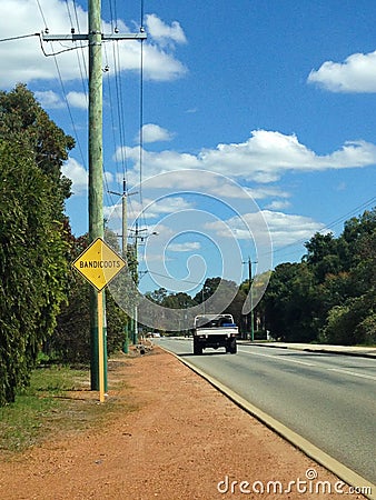 `Bandicoots` sign next to quiet road in Western Australia Stock Photo