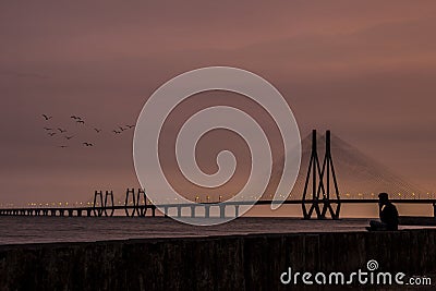 Bandra worli sea link during sunset with amazing shades. Soothing colour of sunset at Mumbai. Room for text. Copy space Stock Photo