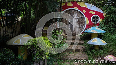 Bandung, Indonesia - July 9, 2022: Miniature hobbit home from the lord of the ring movie and some mushroom stone with circle Editorial Stock Photo