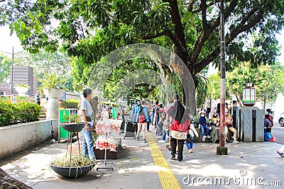 People and Food Vendors are visiting the Great Mosque of Bandung Editorial Stock Photo