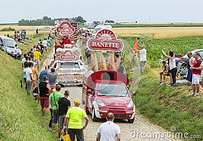 Banette Caravan on a Cobblestone Road- Tour de France 2015 Editorial Stock Photo