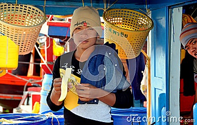 Bang Saen, Thailand: Fisherman Eating Banana Editorial Stock Photo