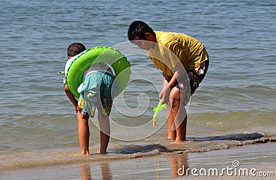 Bang Saen, Thailand: Thai Boys Playing in Sea Editorial Stock Photo
