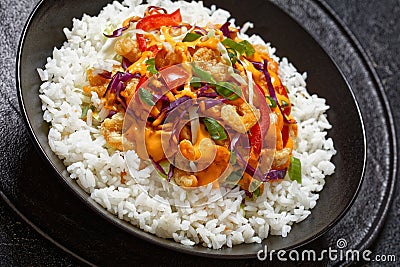 bang bang shrimp rice bowl with fresh veggies Stock Photo