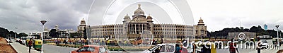 Bangalore, India: Panorama view of hustle bustle on road with transportation against state legislature Editorial Stock Photo