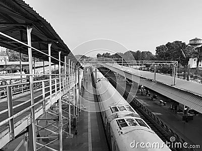 Closeup of Yesvantpur Junction railway station inside view of station corridor, escalator, pedestrian path, trains in a platform Editorial Stock Photo