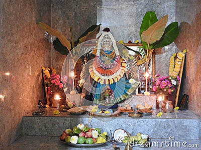 Closeup of beautiful goddess Vara Mahalakshmi decoration with flowers, fruits Editorial Stock Photo