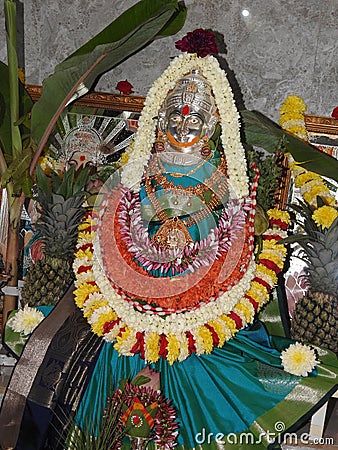 Closeup of beautiful goddess Vara Mahalakshmi decoration with flowers, fruits Editorial Stock Photo