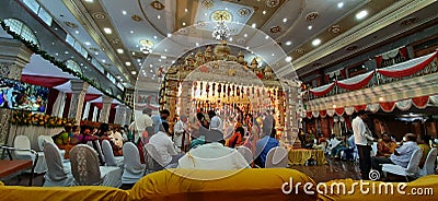 Closeup of beautifully decorated Big Golden Color Wedding Mandapa or Mantapa Design inside the Hindu Marriage Hall Editorial Stock Photo