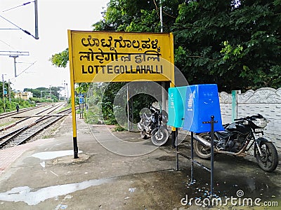 Closeup of Lottegollahalli Railway Station with Yellow and black Color Name Board Editorial Stock Photo