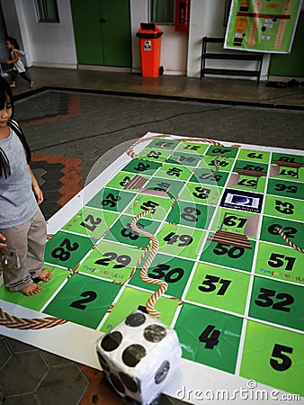 Gigantic rope game or dam tali in Malay language Editorial Stock Photo