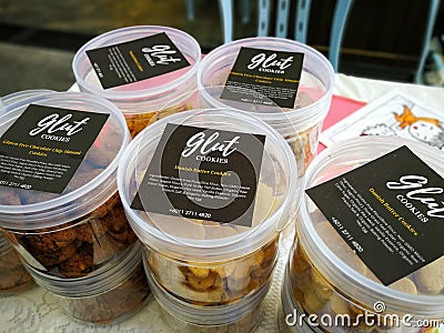 Gluten free cookies in various flavours in a container. Local brand Glut cookies Editorial Stock Photo