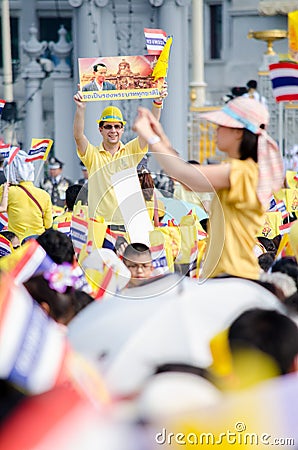 BANGKOK - DECEMBER 5: Thai people sit outside to celebrate for the 85th birthday of HM King Bhumibol Adulyadej on December 5, 2012 Editorial Stock Photo