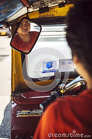 BANGKOK - JUNE 10, 2015: An unidentified tuktuk driver stuck in Editorial Stock Photo