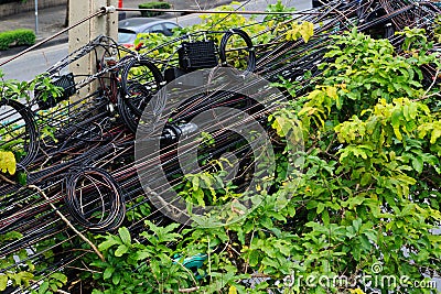 Bangkok,Thailand-01 APR 2018: Chaotic taggled mess of the electric power lines in Bangkok Editorial Stock Photo