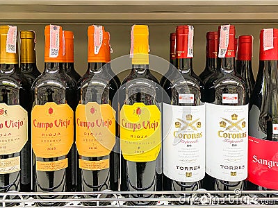 Many bottles of Wines on the shelf for sale Editorial Stock Photo