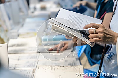 Bangkok, Thailand - April 6, 2019 : People choose books at Bangkok International Book Fair at Queen Sirikit National Convention Editorial Stock Photo