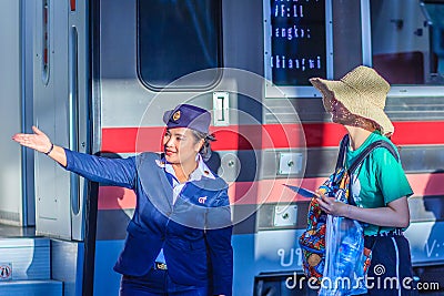 Bangkok, Thailand - April 23, 2017: Uniformed train hostess is w Editorial Stock Photo