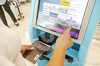 Bangkok, Thailand - August 24, 2019 : Close-up display at self-service transfer machine, doing self-check-in for flight or buying Editorial Stock Photo