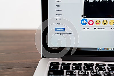 Bangkok, Thailand - August 23, 2017 : Mouse is pressing the Facebook screen on Macbook Pro ,Social media are using for information Editorial Stock Photo
