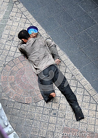 Bangkok, Thailand: Beggar on Silom Road Editorial Stock Photo