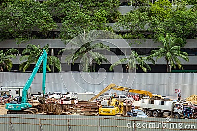 Bangkok - Thailand , 29 2018 : Builder worker and excavator load Editorial Stock Photo