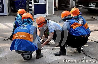 Bangkok, Thailand: Construction Workers with Orange Helmets Editorial Stock Photo
