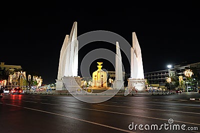 Democracy Monument located at the intersection of the streets of the night city Editorial Stock Photo