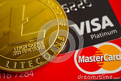 Bangkok, Thailand - December 15, 2021 Golden bitcoin with credit card on US dollar banknotes money for business and commercial, Editorial Stock Photo