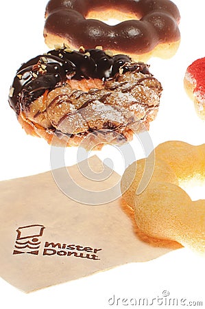 BANGKOK THAILAND - DECEMBER 11 : Many Pon De Rings donuts of mister donuts brand with napkin on white background in BANGKOK THAIL Editorial Stock Photo