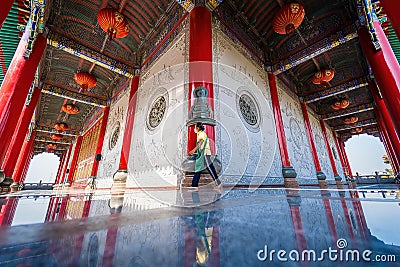 Bangkok, Thailand - December, 20, 2021 :People walking on constricted of beside main building with Stone carving on the wall and Editorial Stock Photo