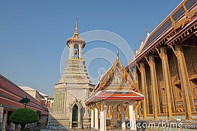 Small religious buildings in the territory of the Temple of the Emerald Buddha on a sunny Editorial Stock Photo