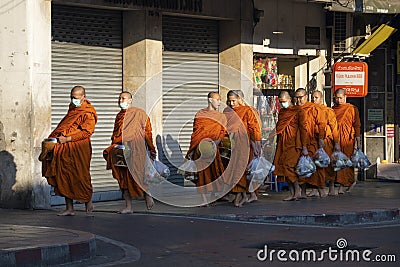 Young monks return to the monastery after morning food gathering Editorial Stock Photo