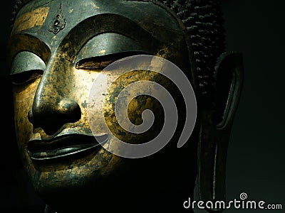 Bangkok, Thailand - Feb 23, 2019: Close up Thai Ancient Solid Head of Buddha, antique bronze Buddha face of Wat Phra Si Sanphet Stock Photo