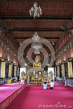 Golden Buddha statue in the Phra Ubosot of Wat Saket Editorial Stock Photo
