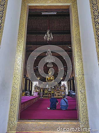 Golden Buddha statue in the Phra Ubosot of Wat Saket Editorial Stock Photo