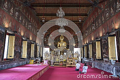 Golden Buddha statue in the Phra Ubosot of Wat Saket Editorial Stock Photo