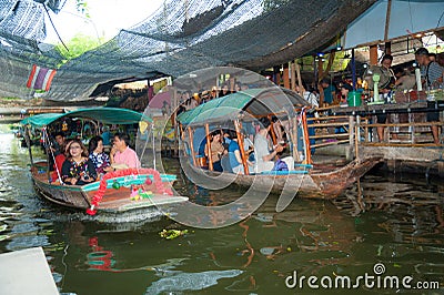 Bangkok, Thailand - Feb 11, 2018: Tourists enjoy traveling by tourist long-tail boat and rowboat on Lad Mayom canal. Editorial Stock Photo